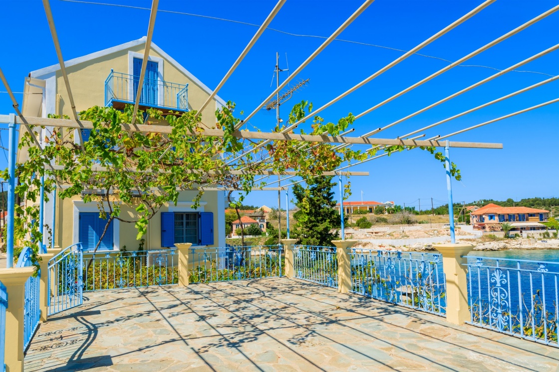 'Traditional greek house with vine growing on terrace in Fiskardo village, Kefalonia island, Greece' - Cefalonia